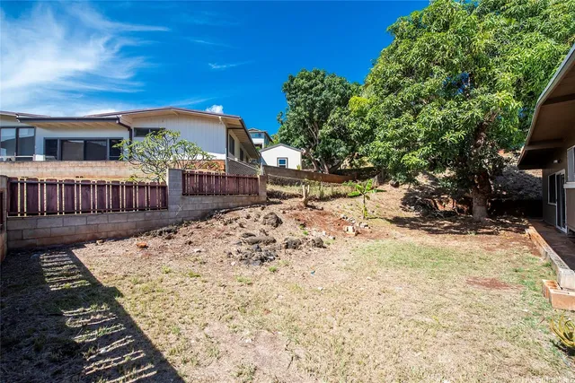 a view of a backyard with a sitting area