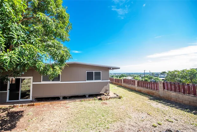 a backyard of a house with lots of green space