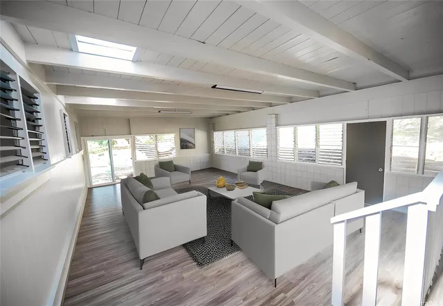 a living room with granite countertop furniture and a fireplace