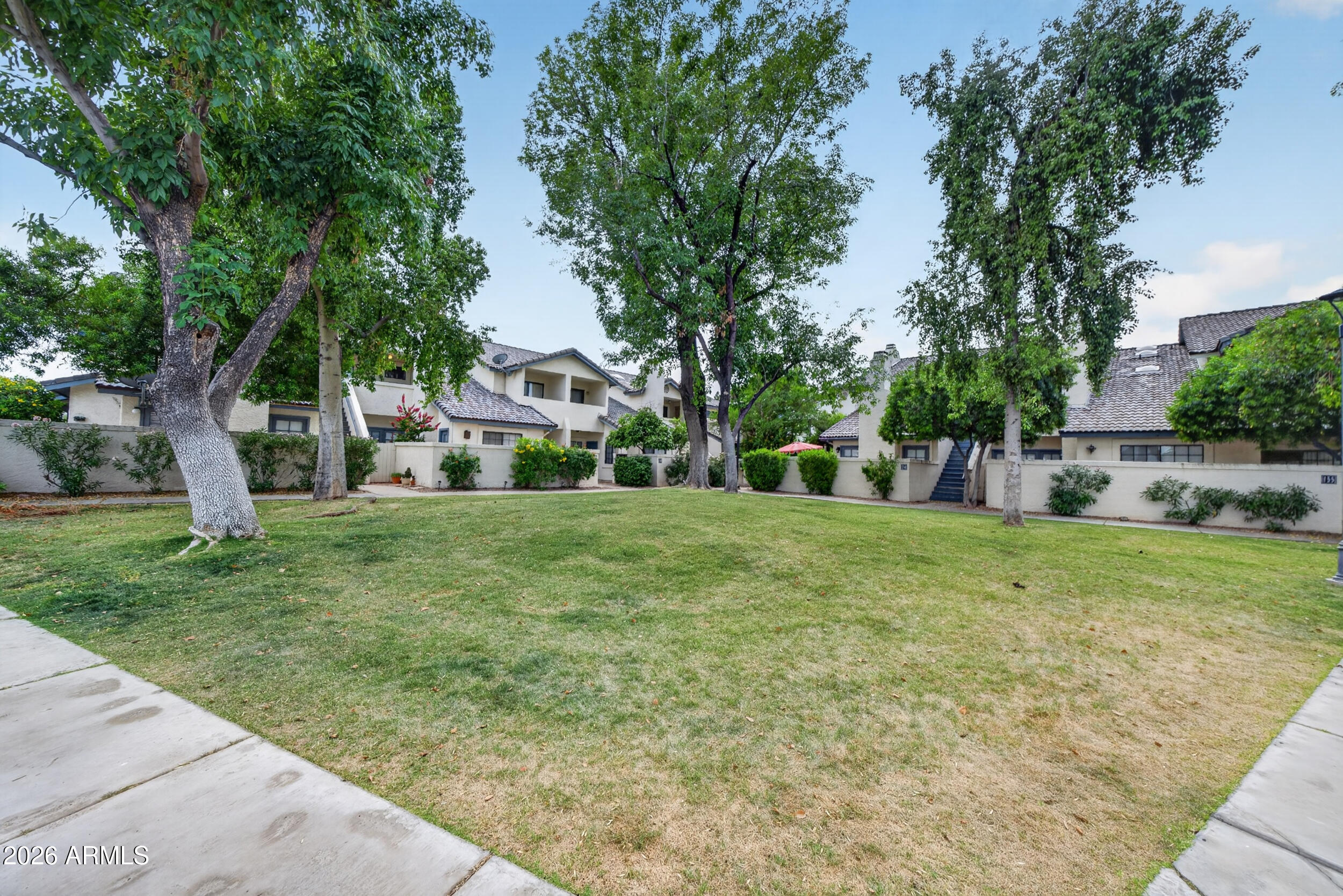 1222 West Baseline Road, Unit 153 Tempe, AZ 85283 - Photo 31 of 33 a view of a house with a yard