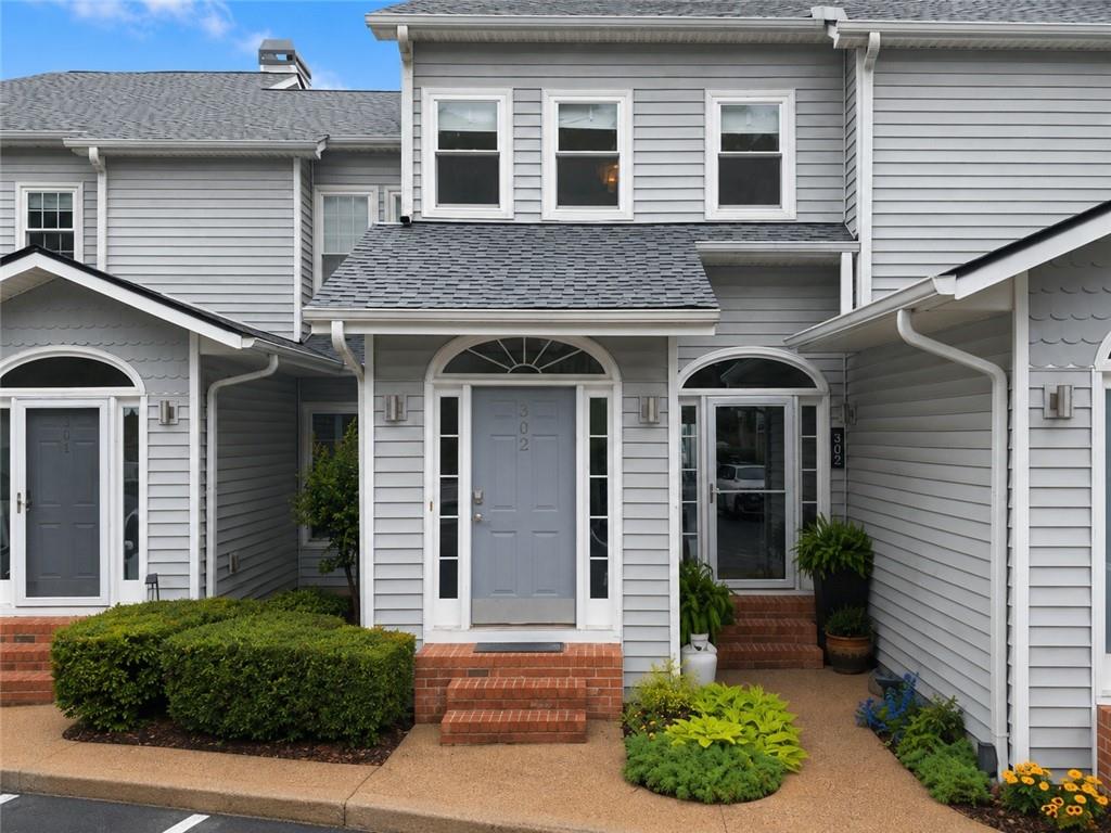 2300 Habersham Marina Road, Unit 302 Cumming, GA 30041 - Photo 2 of 31 a front view of a house with plants