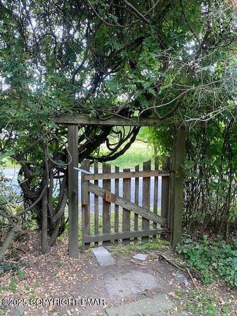 1153 Milford Road Dingmans Ferry, PA 18328 - Photo 11 of 50 a view of a small yard in front of a house with a fountain