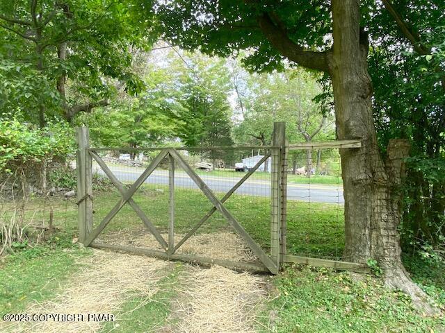 1153 Milford Road Dingmans Ferry, PA 18328 - Photo 14 of 50 a view of an outdoor space and a yard