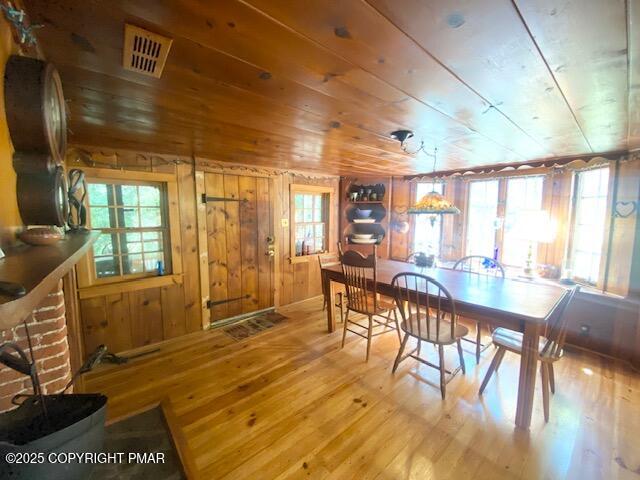 1153 Milford Road Dingmans Ferry, PA 18328 - Photo 24 of 50 a view of a dining room with furniture window and wooden floor