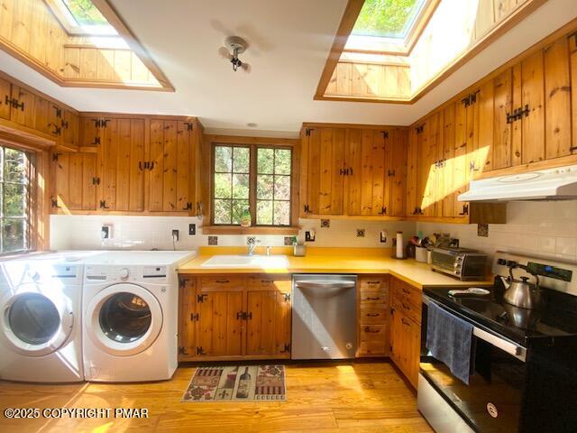 1153 Milford Road Dingmans Ferry, PA 18328 - Photo 29 of 50 a kitchen with a sink a stove top oven and cabinetry