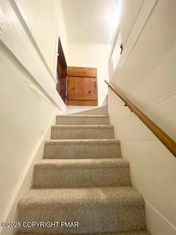 a view of a livingroom with furniture and window
