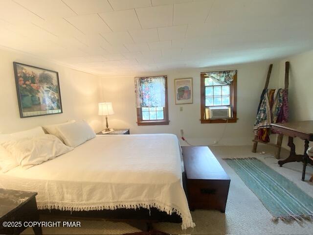 1153 Milford Road Dingmans Ferry, PA 18328 - Photo 41 of 50 a bedroom with a bed a mirror and a window