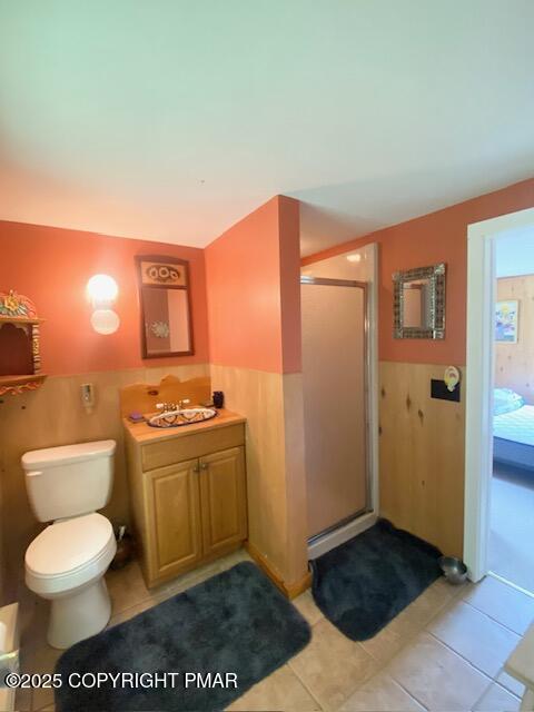 1153 Milford Road Dingmans Ferry, PA 18328 - Photo 42 of 50 a bathroom with a toilet a sink and mirror