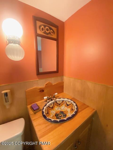 1153 Milford Road Dingmans Ferry, PA 18328 - Photo 43 of 50 a bathroom with a toilet sink and mirror