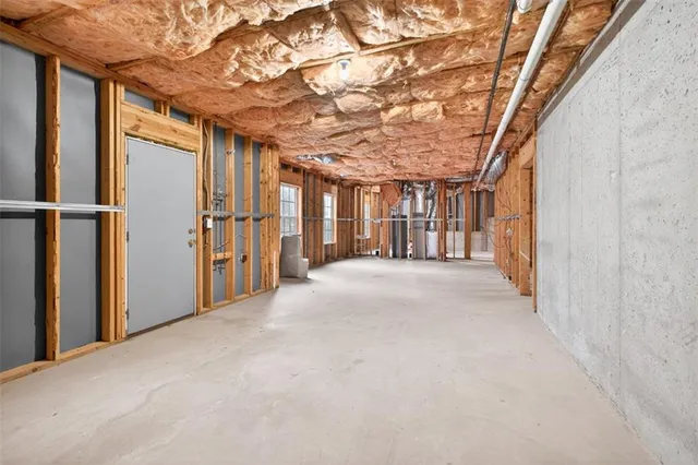 a view of a hallway with seating area