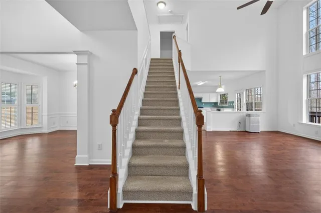 a view of an entryway with wooden floor and stairs