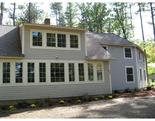 98 Kingland Road Stow, MA 01775 - Photo 11 of 15 a view of a house with a yard