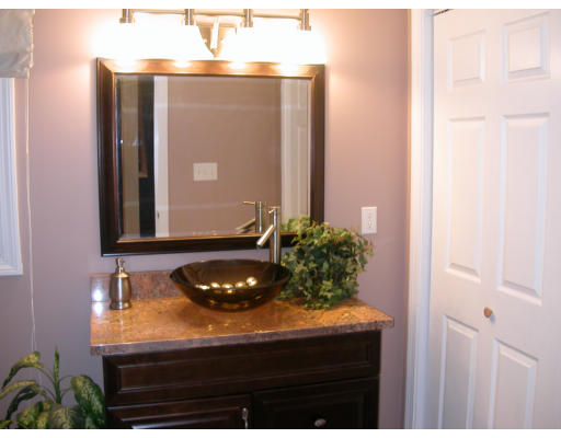98 Kingland Road Stow, MA 01775 - Photo 6 of 15 a bathroom with a sink and a mirror