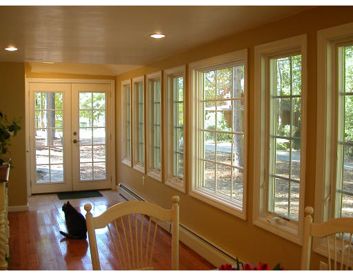 98 Kingland Road Stow, MA 01775 - Photo 7 of 15 a living room with furniture and floor to ceiling windows
