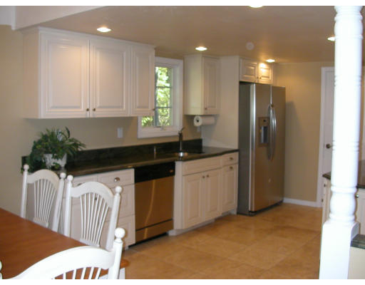 98 Kingland Road Stow, MA 01775 - Photo 8 of 15 a kitchen that has a sink and a refrigerator