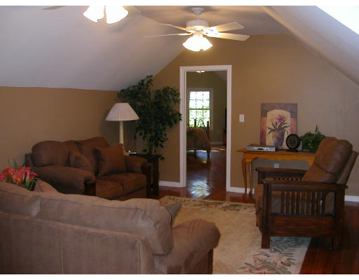 98 Kingland Road Stow, MA 01775 - Photo 9 of 15 a living room with furniture a lamp and a chandelier