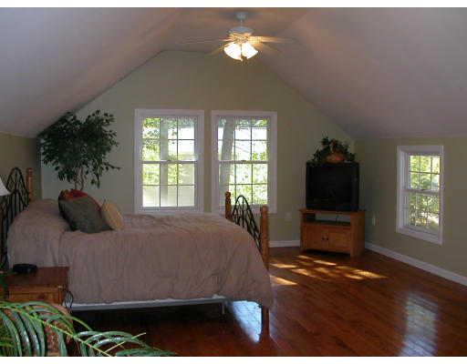98 Kingland Road Stow, MA 01775 - Photo 10 of 15 a bedroom with a bed and a flat tv screen on dresser