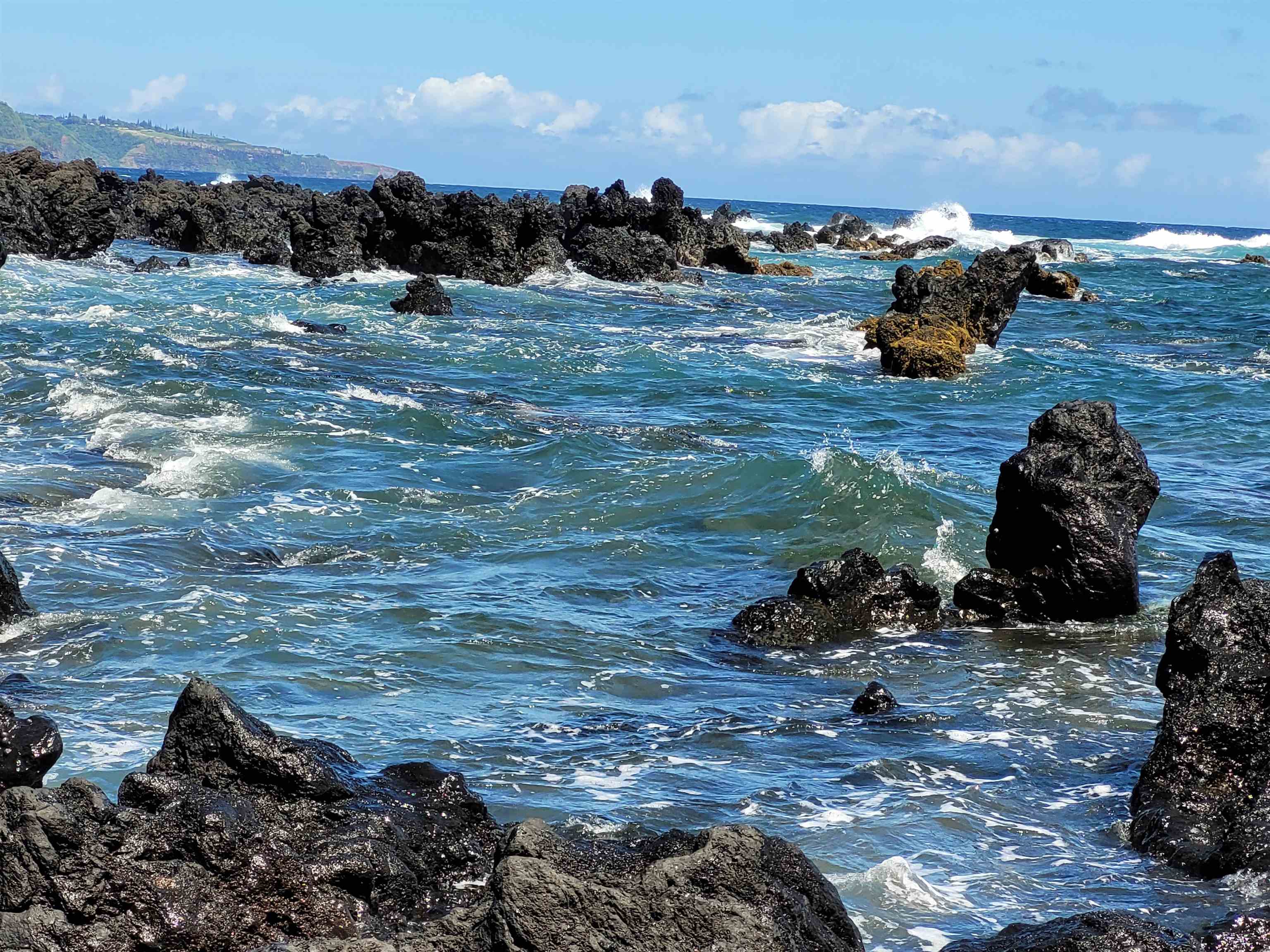 Keanae Road Hana, HI 96713 - Photo 13 of 29 a view of a backyard with table and chairs and mountain view