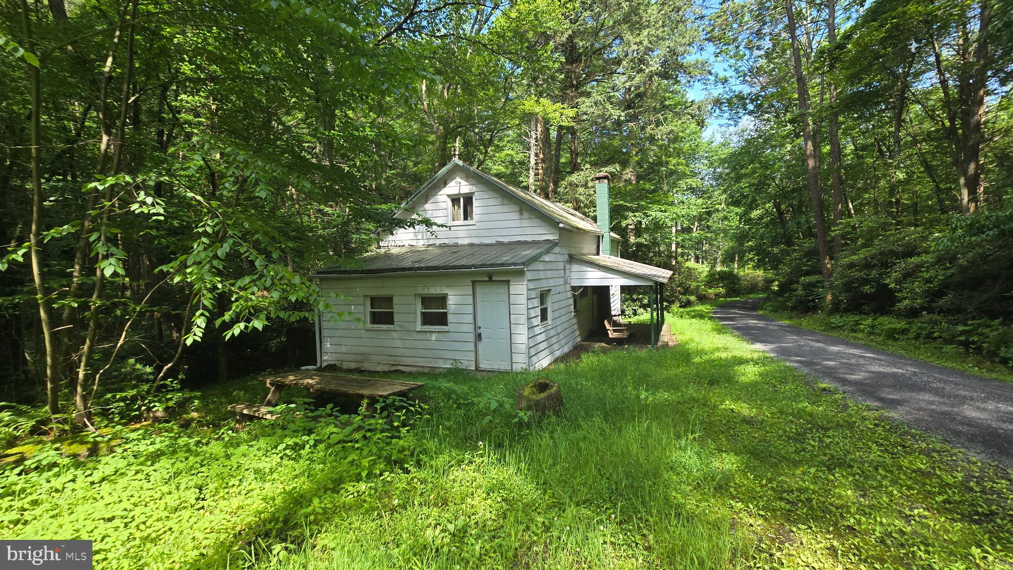 212 Thickhead Mountain Road Centre Hall, PA 16828 - Photo 3 of 28 Charming retreat nestled in lush greenery.