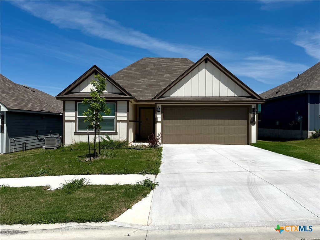 10016 Avendesora Road Killeen, TX 76542 - Photo 1 of 24 a front view of a house with a yard and garage