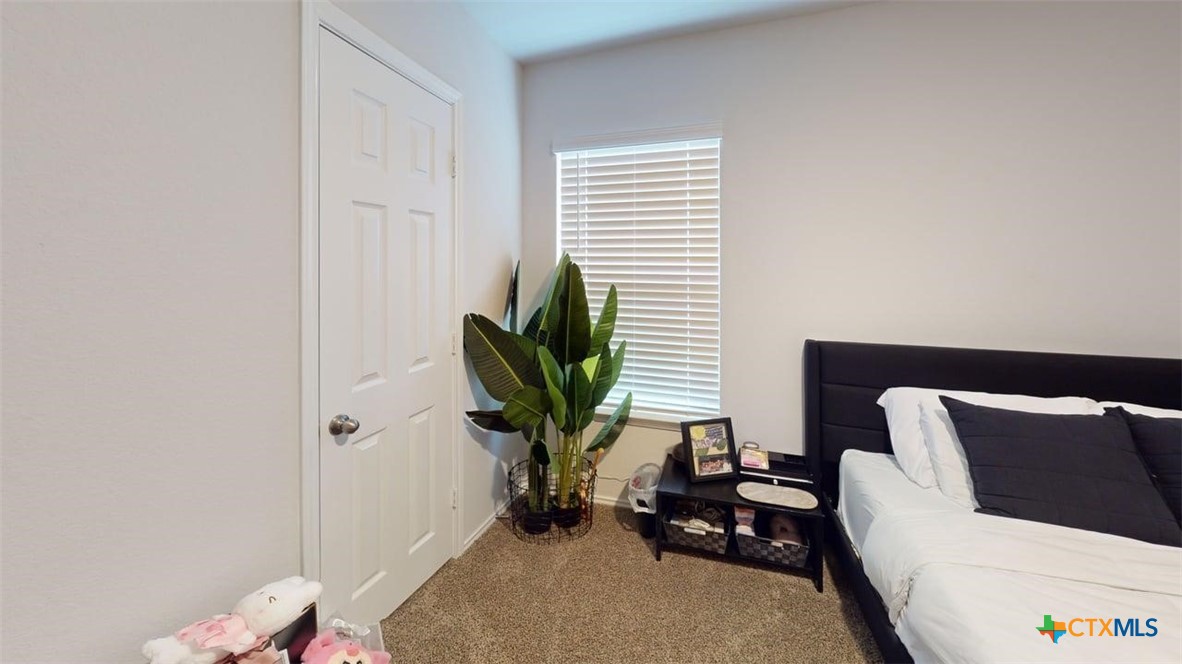 10016 Avendesora Road Killeen, TX 76542 - Photo 12 of 24 a bedroom with a bed and a window
