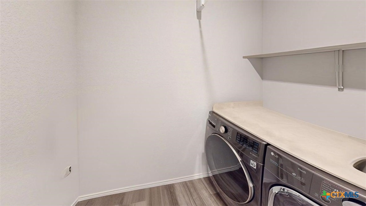 10016 Avendesora Road Killeen, TX 76542 - Photo 15 of 24 a utility room with dryer and washer