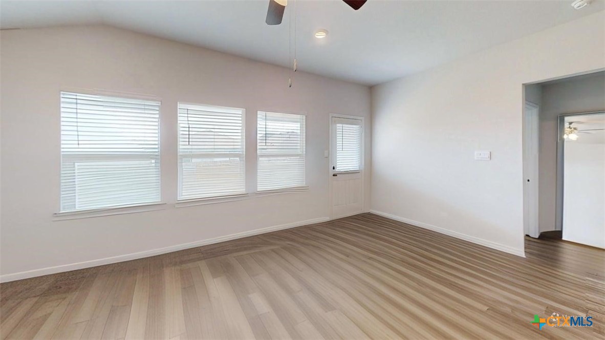 10016 Avendesora Road Killeen, TX 76542 - Photo 20 of 24 an empty room with wooden floor and windows