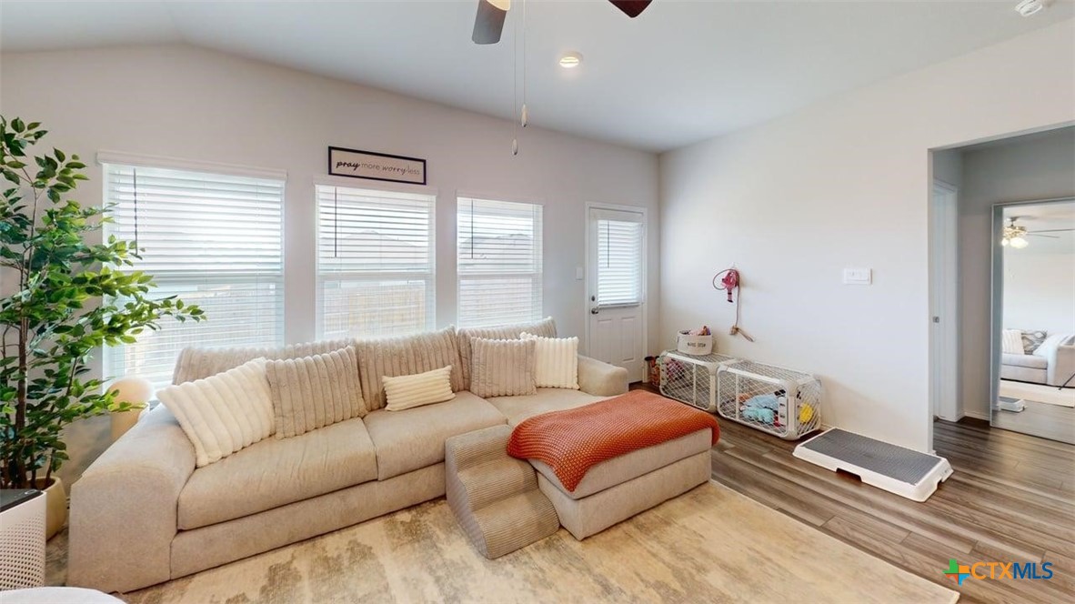 10016 Avendesora Road Killeen, TX 76542 - Photo 2 of 24 a living room with furniture a flat screen tv and a large window