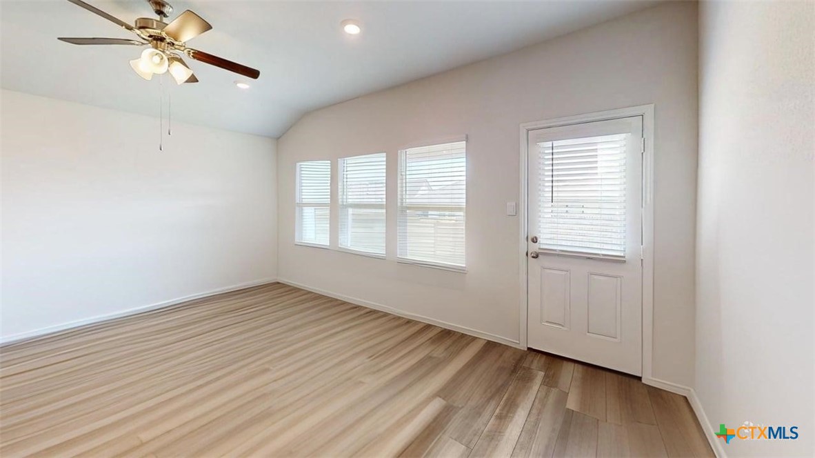 10016 Avendesora Road Killeen, TX 76542 - Photo 21 of 24 a view of an empty room with a window and wooden floor
