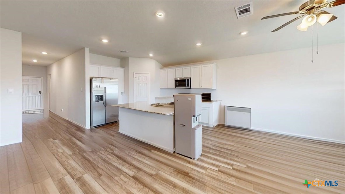 10016 Avendesora Road Killeen, TX 76542 - Photo 5 of 24 a kitchen with stainless steel appliances a refrigerator and a stove top oven