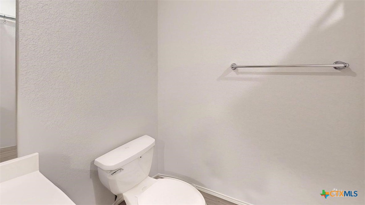 10016 Avendesora Road Killeen, TX 76542 - Photo 10 of 24 a white toilet sitting next to a shower