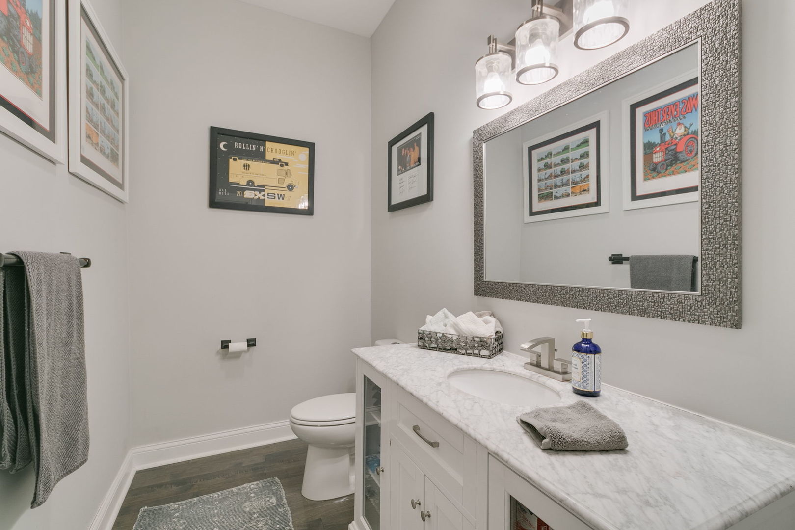 3239 Wesley Avenue Berwyn, IL 60402 - Photo 8 of 29 a bathroom with a granite countertop sink a toilet and mirror