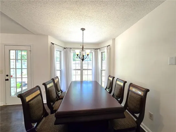 a view of a dining room with furniture window and outside view