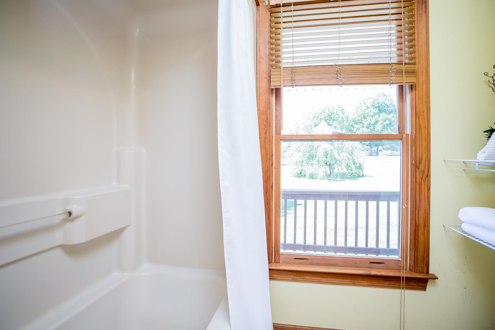 8455 East Timber Ridge Road Mount Crawford, VA 22841 - Photo 13 of 62 a bathroom with a bathtub and next to a window