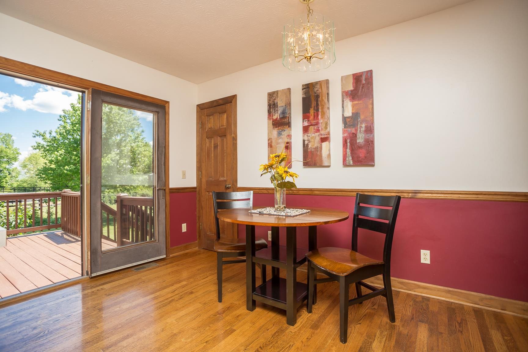 8455 East Timber Ridge Road Mount Crawford, VA 22841 - Photo 20 of 62 a view of a dining room with furniture window and wooden floor