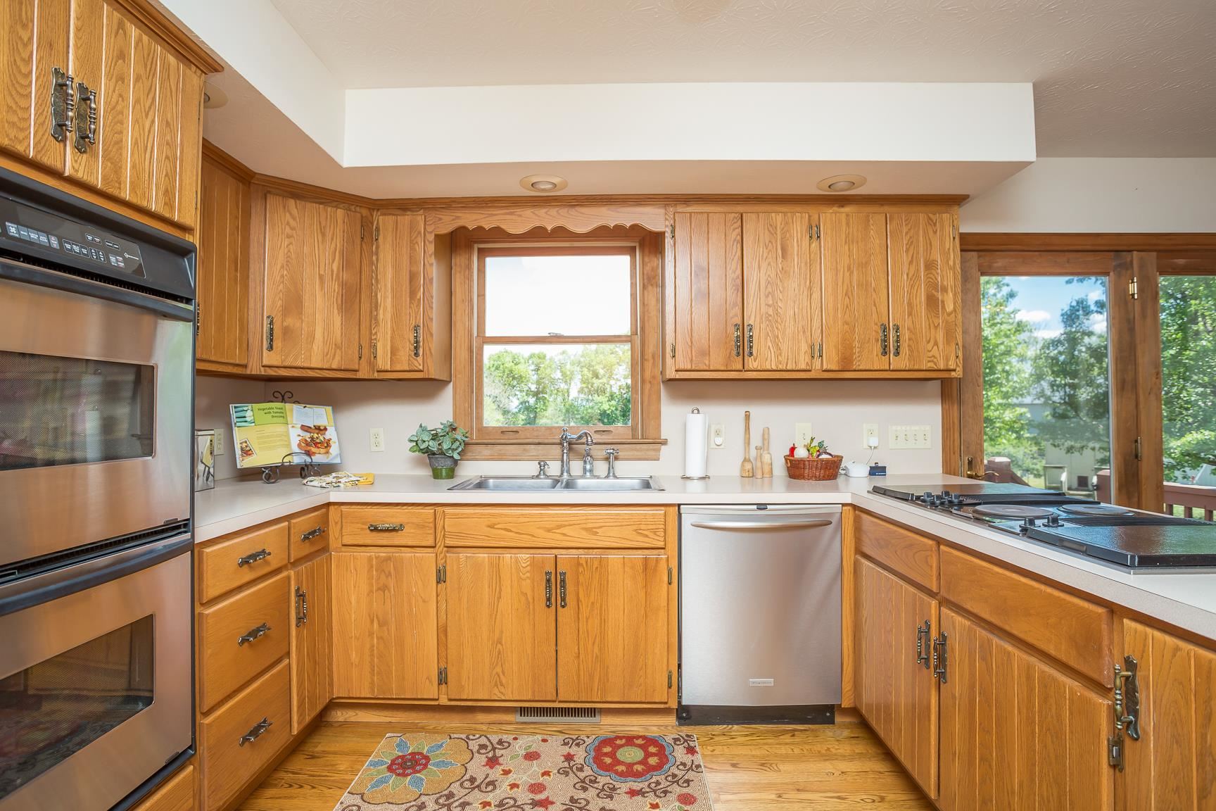 8455 East Timber Ridge Road Mount Crawford, VA 22841 - Photo 24 of 62 a kitchen with stainless steel appliances a sink a stove a refrigerator cabinets and a window