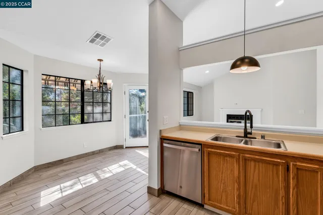 a kitchen with a sink and window