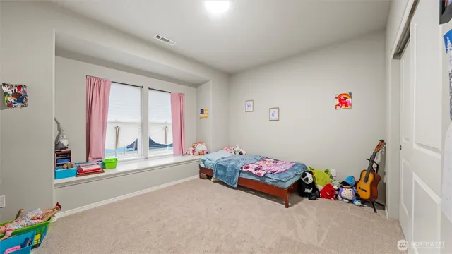 a bedroom with toys and a bed