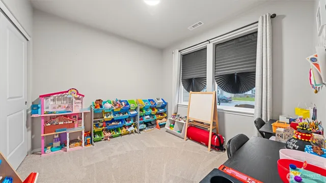 a living room with baby toys