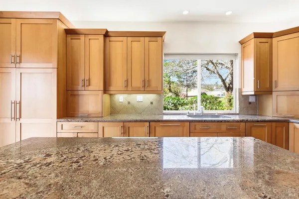a view of a kitchen with a window