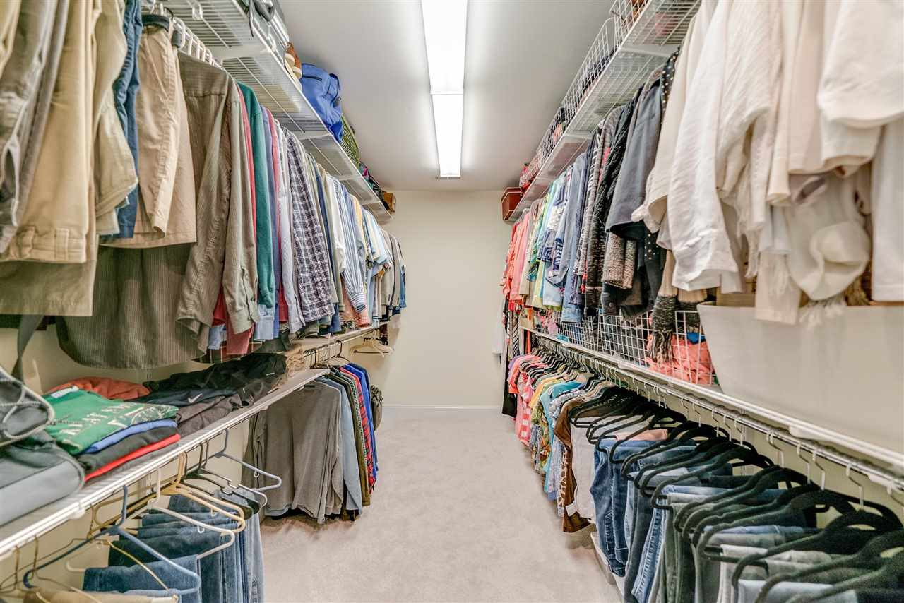 9301 Foxburrow Court Raleigh, NC 27613 - Photo 15 of 25 Everyone woman (and man's!) dream! This closet was extended to provide ample space for any storing needs! Master Closet