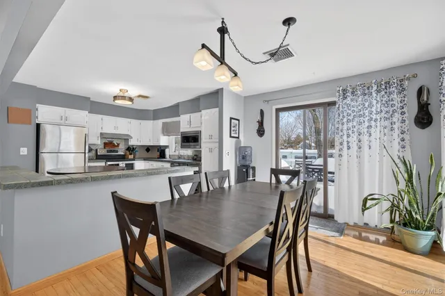 a dining room with furniture and window