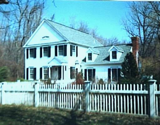 446 Belden Hill Road Wilton, CT 06897 - Photo 1 of 1 a view of a brick house with large windows