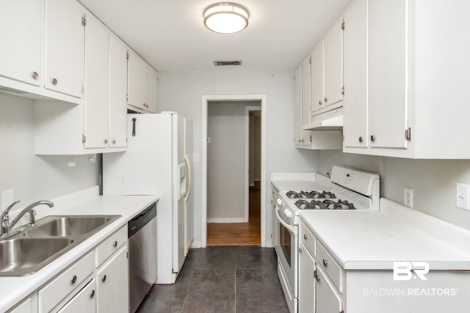 320 Vanderbilt Drive Mobile, AL 36608 - Photo 23 of 39 Kitchen with white cabinets, dishwasher, dark hardwood / wood-style flooring, white range with gas cooktop, and sink