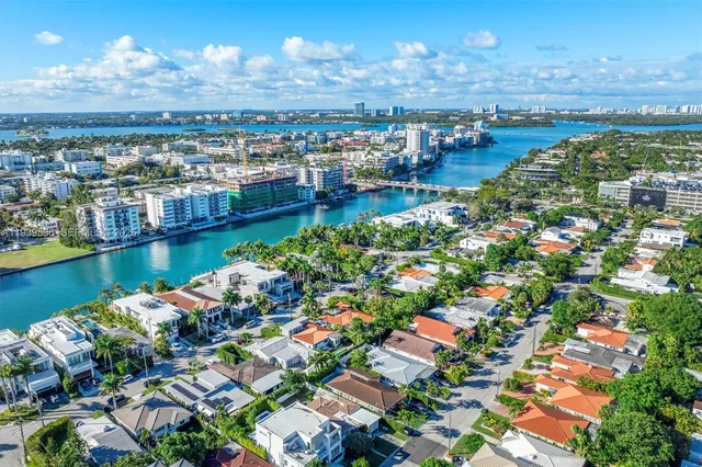 a view of a city with lots of residential buildings lake and ocean view