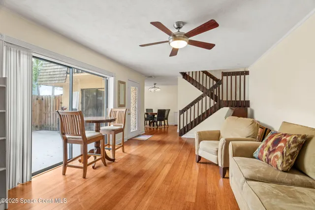 a view of entryway with wooden floor and stairs