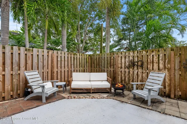 a view of a backyard with potted plants