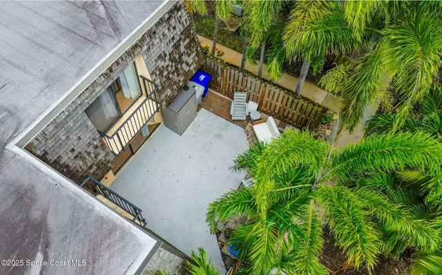 an aerial view of multiple houses with yard