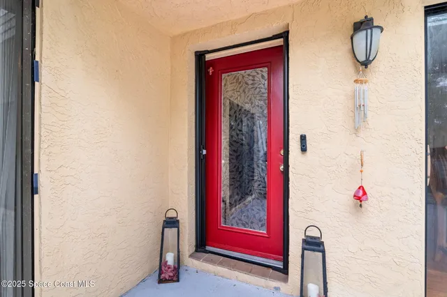 a kitchen with a dining table chairs stainless steel appliances and cabinets