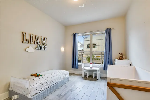 a living room with furniture and next to a window